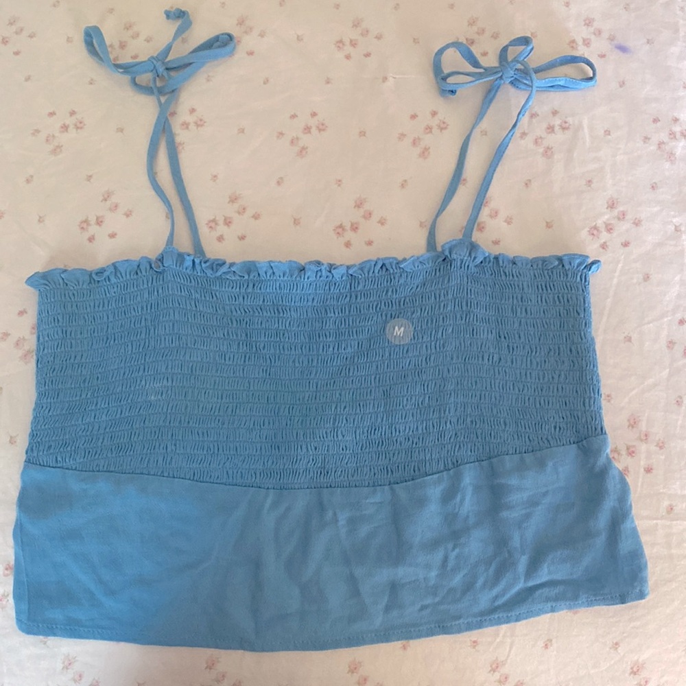 Blue stretchy crop top with adjustable straps